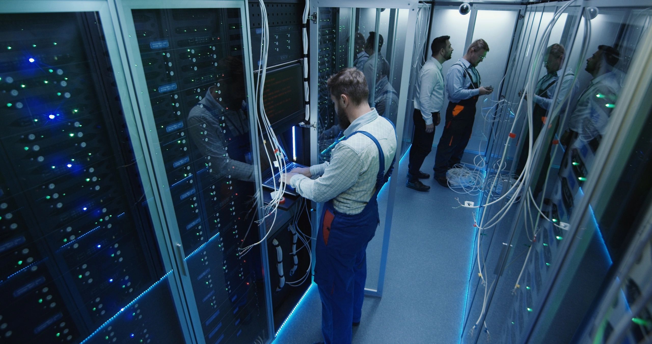 Engineers coordinating work inside a data center