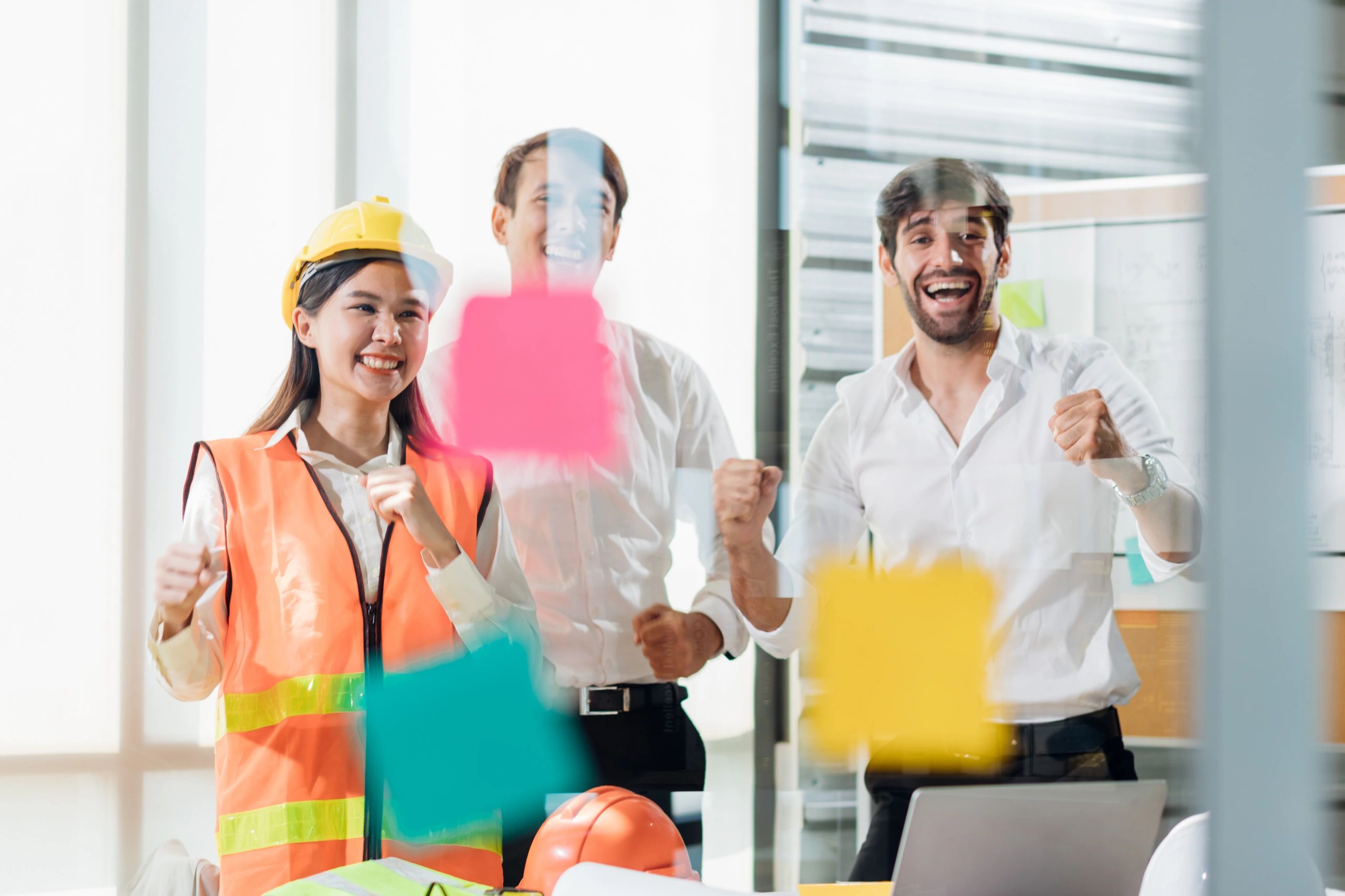 Engineers in a safety meeting wearing helmets