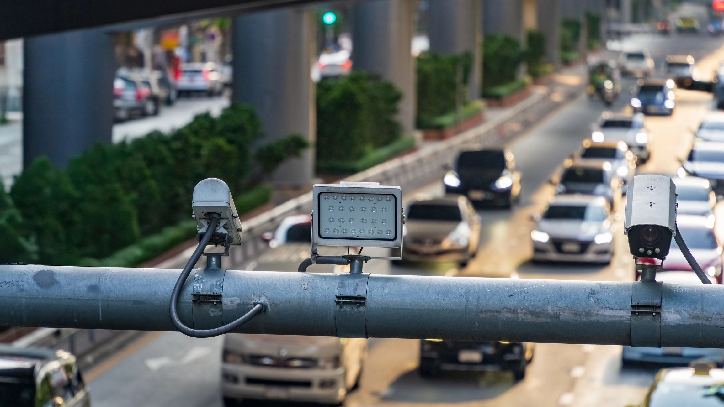 Video surveillance cameras monitoring a busy roadway