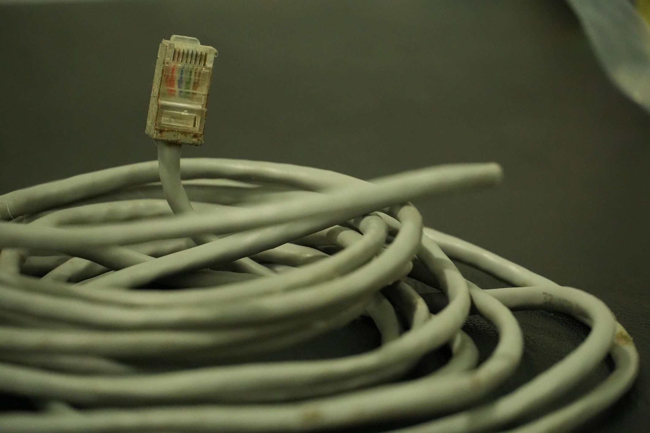 Coiled Ethernet cable representing passive networking components